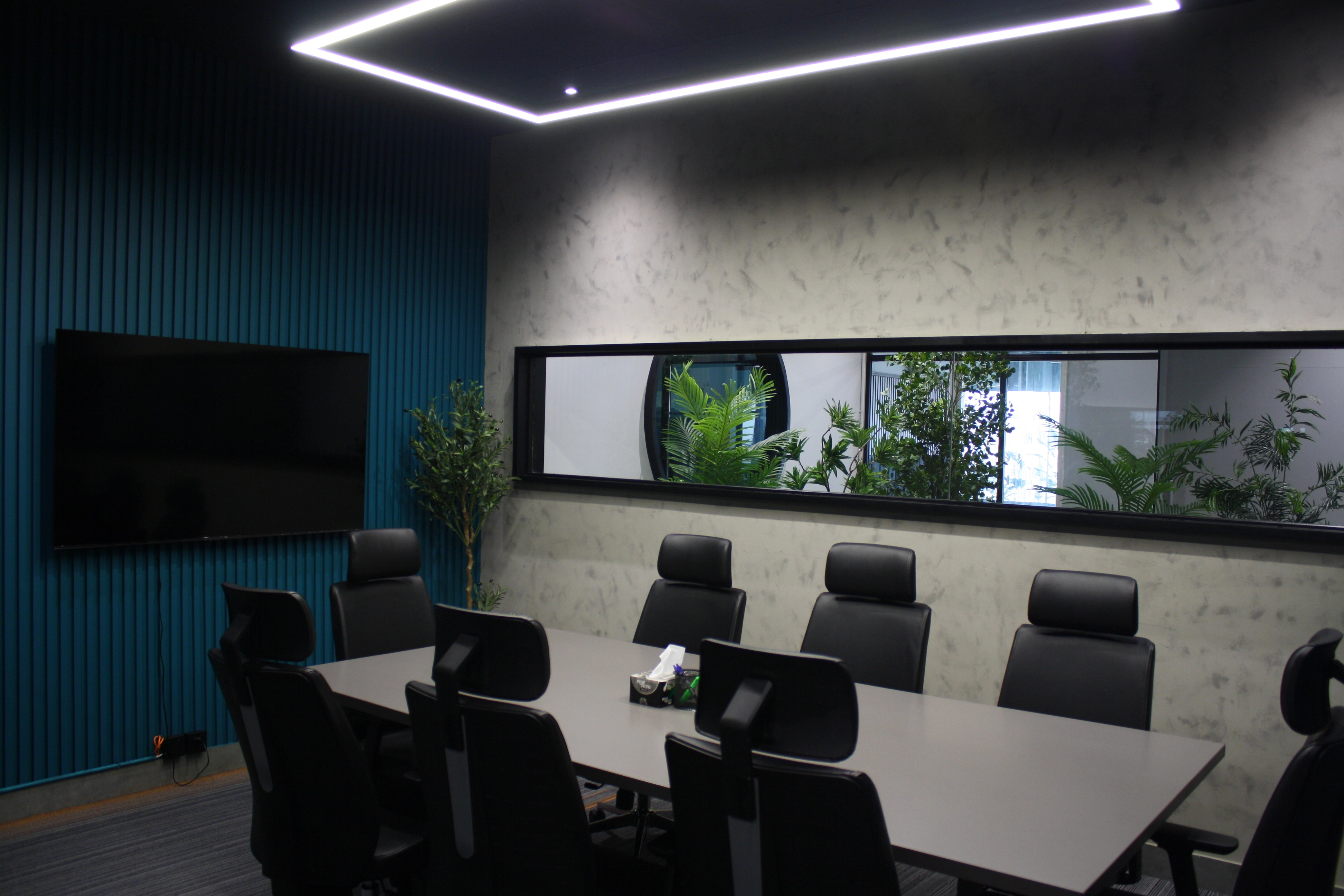 Meeting room featuring conference table and AV equipment